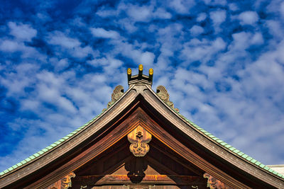 Low angle view of statue of building against sky