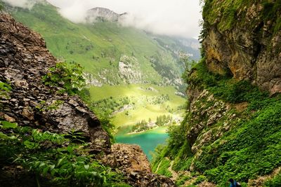 Tranquil view of lake at amidst mountains