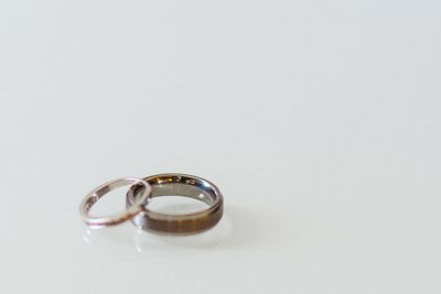 Close-up of wedding rings on white background