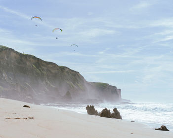 Scenic view of beach against sky