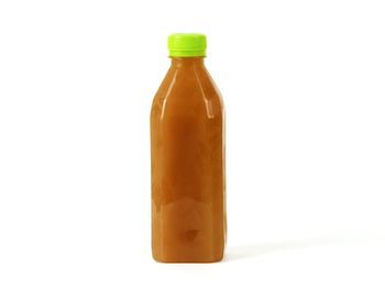 Close-up of bottle against white background