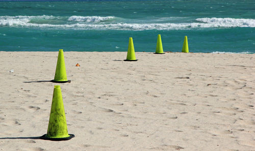 Green cones on beach