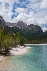 Scenic view of lake against cloudy sky