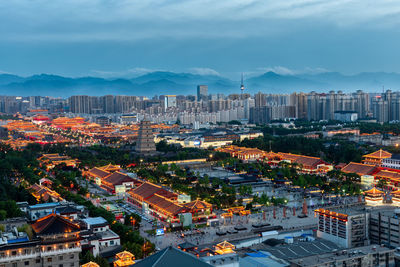 High angle view of buildings in city against sky