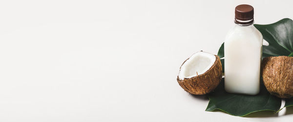 Close-up of christmas decorations against white background