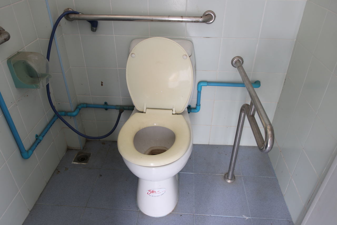 HIGH ANGLE VIEW OF WHITE BATHROOM AND TOILET