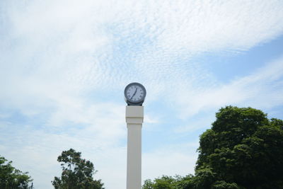 Low angle view of clock tower against sky