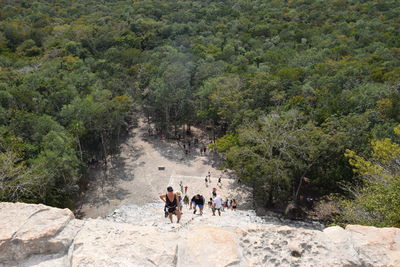 High angle view of people walking on rocks