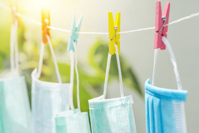 Close-up of clothespins hanging on clothesline