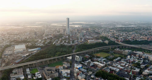 High angle view of city buildings against sky