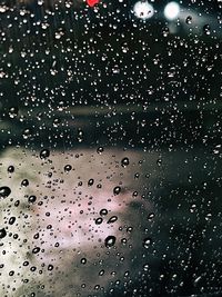 Full frame shot of raindrops on glass window