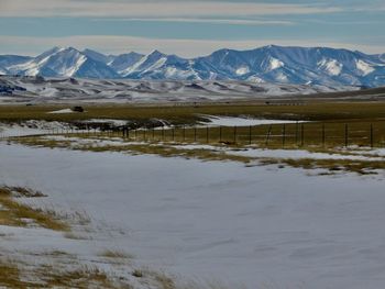 Scenic view of snowcapped mountains against sky