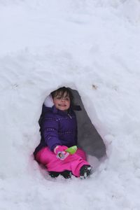 Full length of cute girl in snow