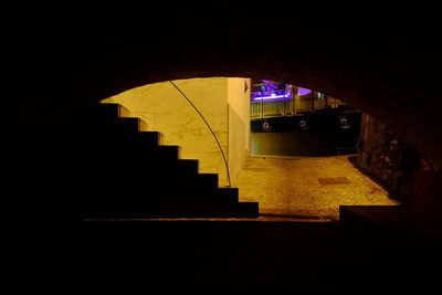 Illuminated staircase at night