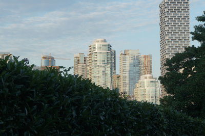 Buildings in city against sky