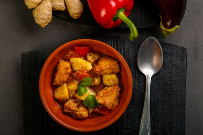 Food for suhoor in ramadan lamb stew with potatoes vegetables on a gray background. horizontal photo