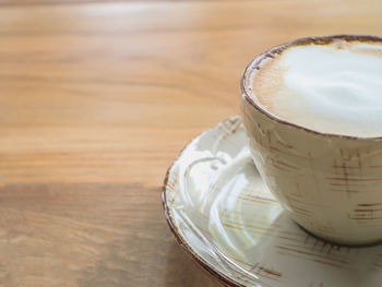 Close-up of coffee cup on table