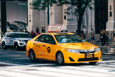 Yellow car on city street