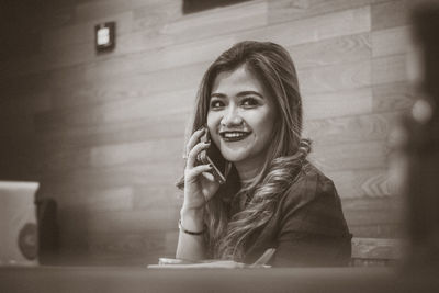 Close-up of smiling young woman