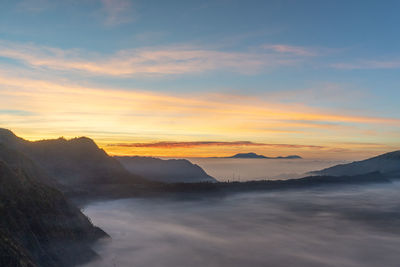 Scenic view of mountains against sky during sunset