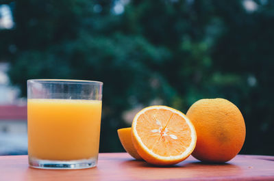 Close-up of orange juice on table