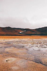 Scenic view of landscape against sky in hverir