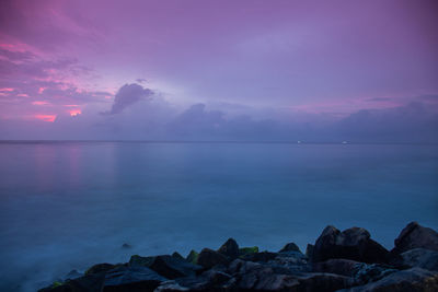 Scenic view of sea against sky at sunset