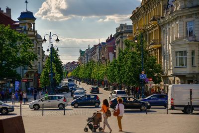 People walking on street in city