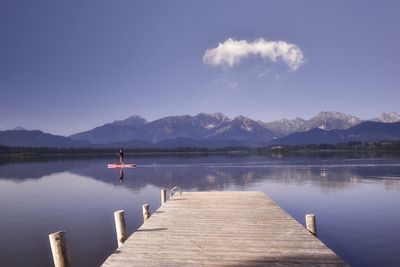 Pier over lake against sky