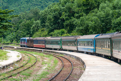 Train at railroad station against sky