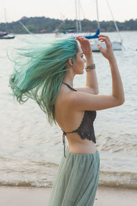 Woman standing at beach