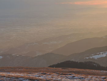 Scenic view of mountains against sky during sunset