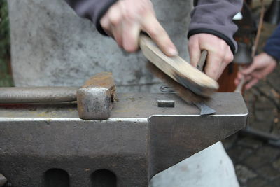 Midsection of worker working in workshop