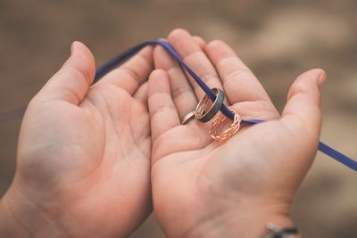 Close-up of hand holding rings