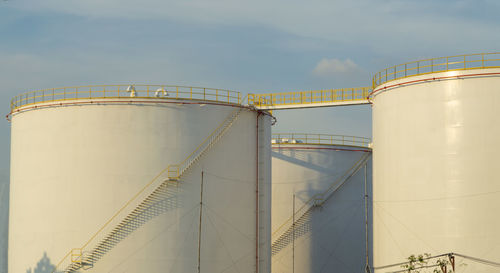 Low angle view of factory against sky