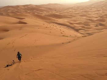 Woman walking in desert