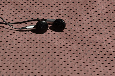 In-ear headphones on textile