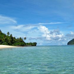 Scenic view of sea against cloudy sky