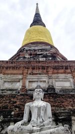 Statue of buddha against sky