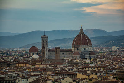 Buildings in city against sky