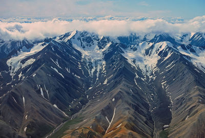 Aerial view of alpine glaciers cut in remote mountains in denali national park in alaska