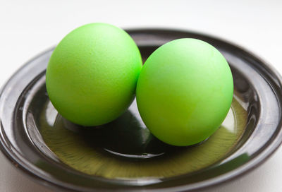 Close-up of green eggs in plate