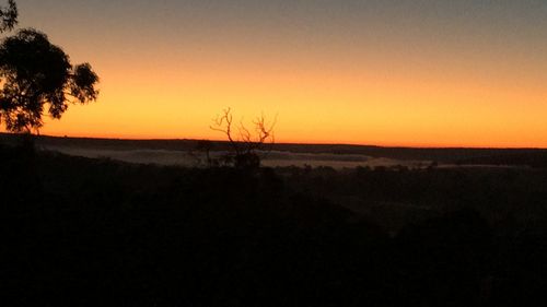 Scenic view of silhouette landscape against sky during sunset