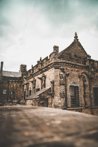 Low angle view of old building against sky