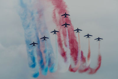 Low angle view of airshow in sky