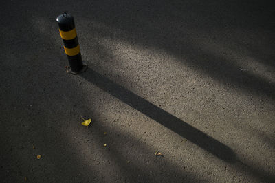 Yellow bollard on street