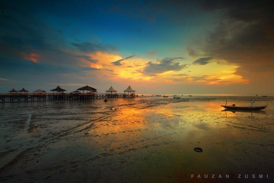 sunset, water, sea, sky, scenics, tranquil scene, orange color, reflection, beauty in nature, tranquility, beach, horizon over water, cloud - sky, idyllic, nautical vessel, nature, shore, dusk, boat, silhouette