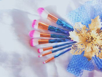 High angle view of make-up brushes and decorations