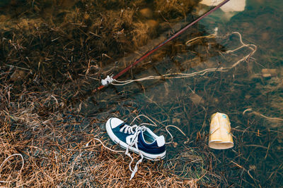 High angle view of shoes on field