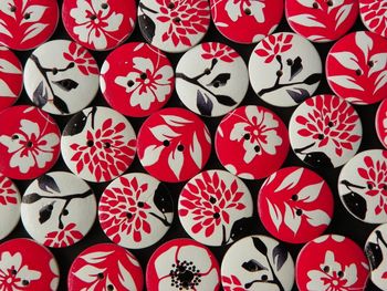 Full frame view of circular buttons with floral pattern